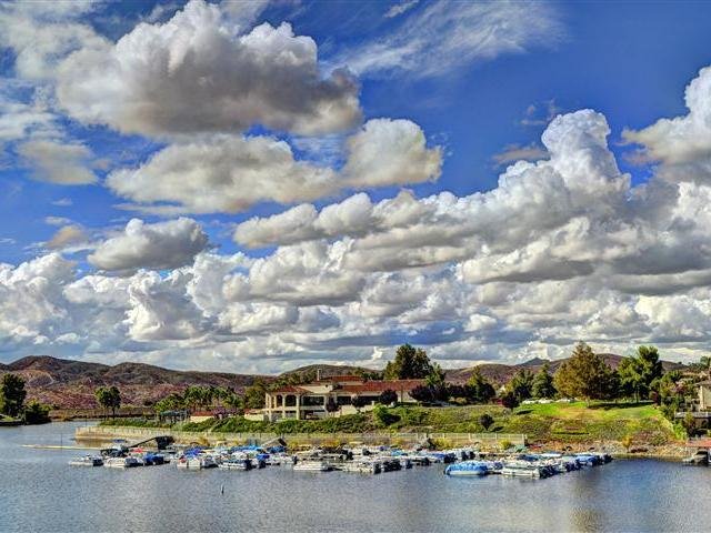 Boats docked at the Canyon Lake marina under a cloudy sky