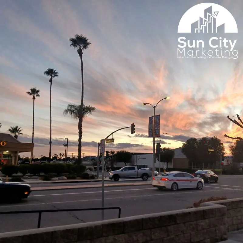 Sun City Marketing logo overlaid on a vibrant sunset view of McCall Blvd and Sun City Blvd in Menifee, CA, featuring local website design and internet marketing services.